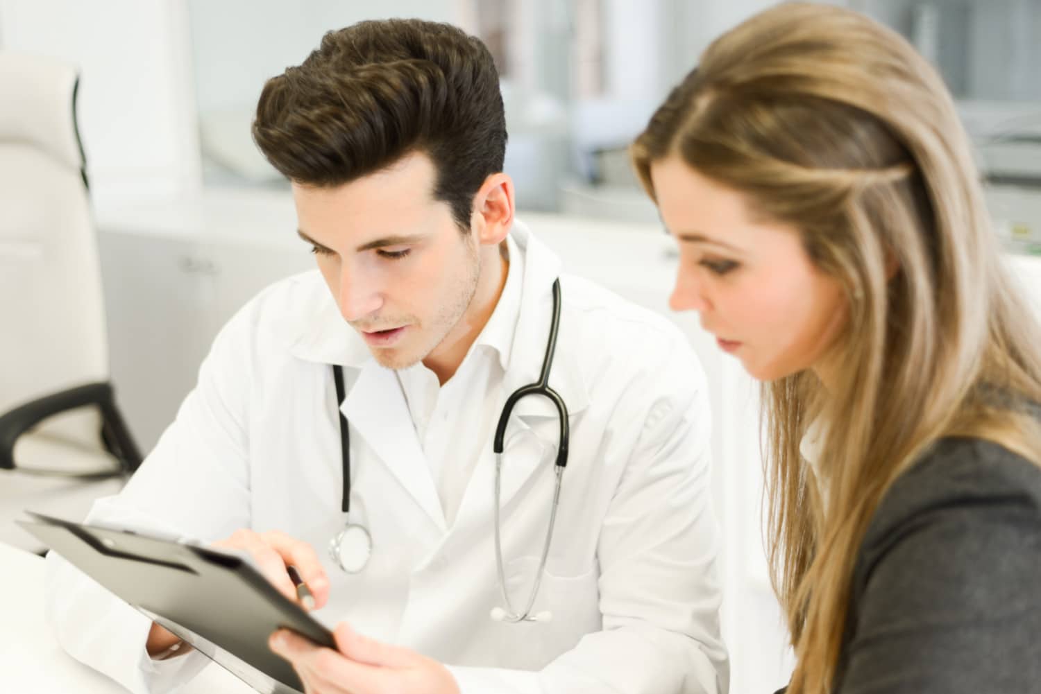 Female doctor explaining diagnosis to her female patient