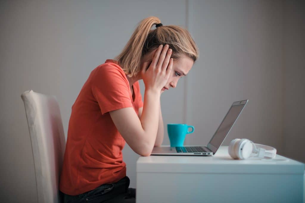 Woman in front of laptop worried about Mammogram interpretation for breast cancer - Maiden Lane Medical, Midtown, NY
