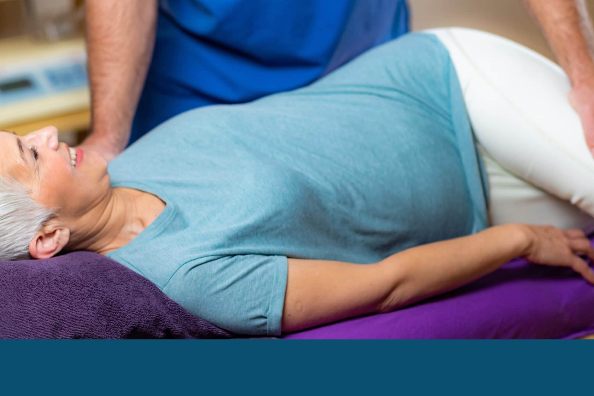 A female patient being helped with pelvic pain by a physical therapist. - Maiden Lane Medical | New York