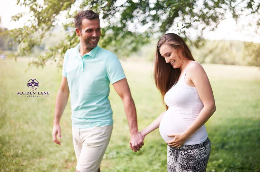 A woman with Braxton Hicks taking a walk to relieve her contraction discomfort.